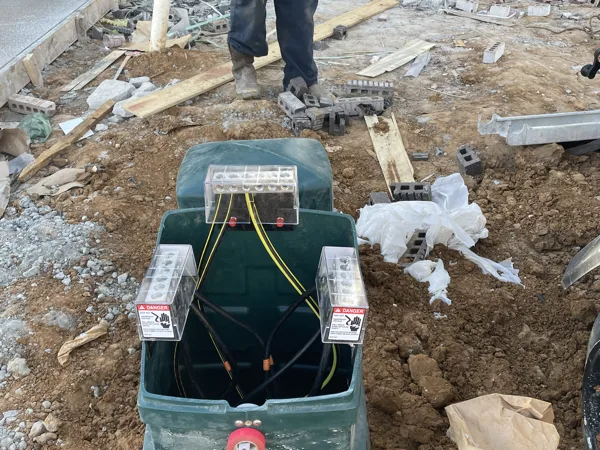 Pad mounted transformer set on the site with the primary elbows in place