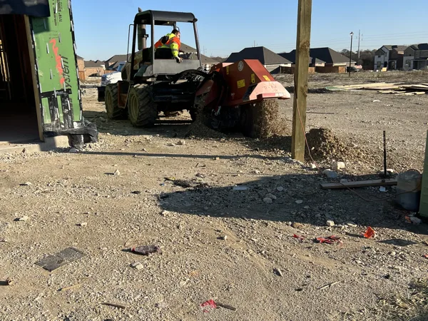 Telehandler at a framed building on the site