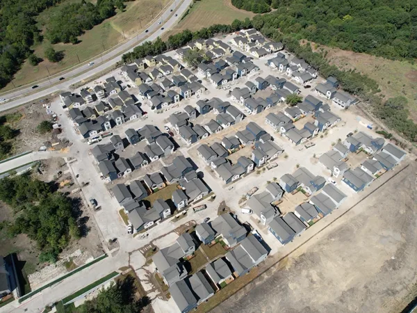 Aerial view of the finished community with its streets and homes