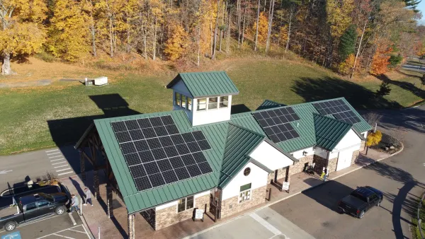 Solar array on the green metal roof of the Atwood Lake welcome center in Mineral City, Ohio