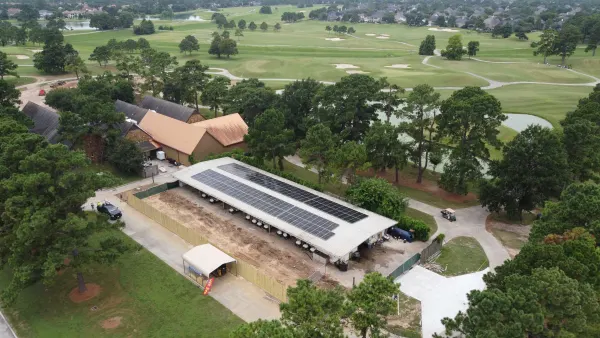 Solar array on a golf-cart barn beside the fairways of Gleannloch Pines Golf Club in Spring, Texas