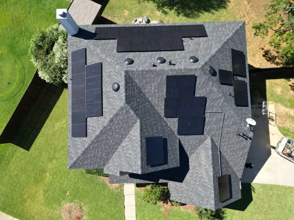 Top-down view of a 15 kW solar array laid out across a hip roof in Hickory Creek, Texas