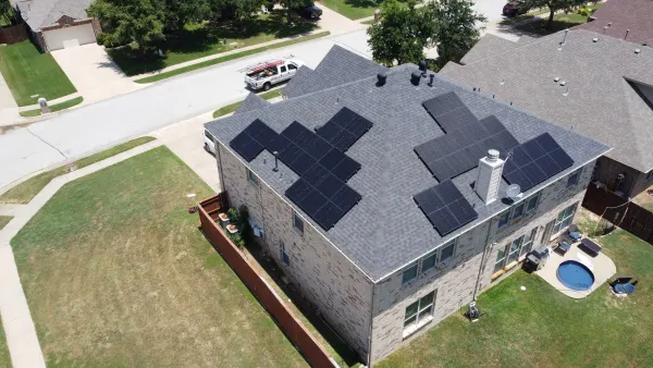 9.7 kW solar array on the shingle roof of a two-storey home in Grapevine, Texas