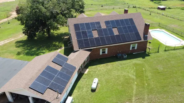 19 kW solar array across the house and garage roofs of a rural home in Rusk, Texas